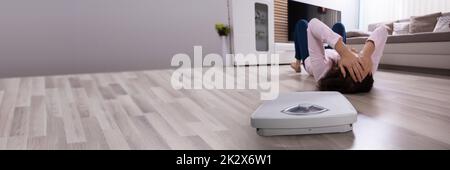 Close-up d'une balance sur plancher de bois franc Banque D'Images
