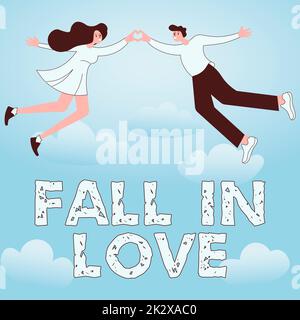 La légende conceptuelle TOMBE AMOUREUSE. L'idée d'affaires charmé ou captivé avec quelqu'un Saint-Valentin couple tenant les mains formant coeur romantique représentant l'amour. Banque D'Images