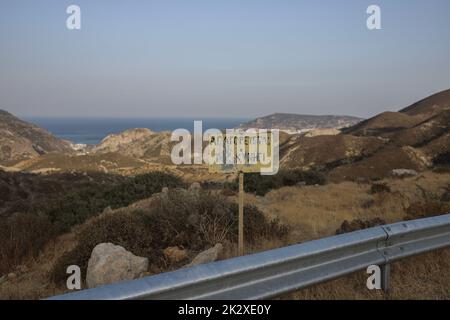 Karpathos, Greece. 11th Aug, 2021. A warning sign post saying 'Hunting is forbidden' in Karpathos Island. Karpathos is the second largest island of the Greek Dodecanese island complex, in the southeastern Aegean Sea. Karpathos island still keeps its traditional way of life, such as 'Olympos' village, where the natives still wear the traditional costumes. (Photo by Maria Makraki/SOPA Images/Sipa USA) Credit: Sipa USA/Alamy Live News Stock Photo