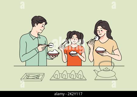 La famille avec un enfant apprécie la cuisine asiatique Banque D'Images