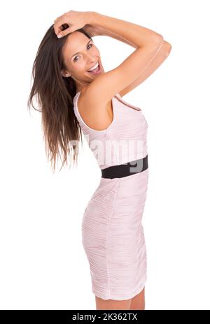 Fashionista. Studio portrait d'une belle jeune femme posant dans une robe rose. Banque D'Images