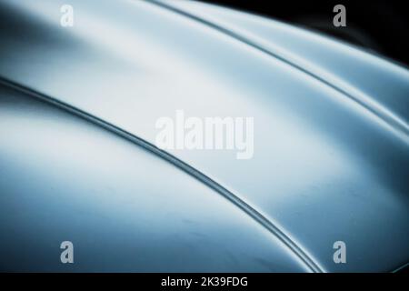 Photo abstraite floue et floue d'un capot de voiture de luxe Banque D'Images
