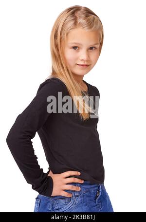 Shes un petit modèle. Une jeune fille mignonne posant sur un fond blanc. Banque D'Images