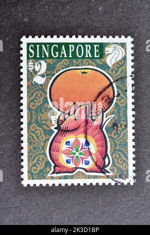 SINGAPOUR - VERS 1996: Un timbre imprimé à Singapour montre l'année zodique des timbres Rat, vers 1996. Banque D'Images