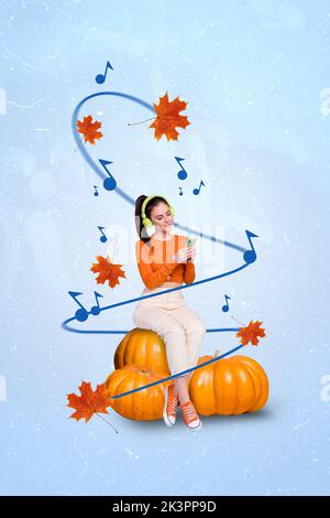 Montage vertical image de la petite fille paisible assis citrouille tenir téléphone écouter la musique volant feuille d'érable isolée sur le fond de dessin Banque D'Images