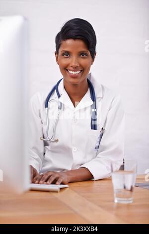 Shes the best doctor around. an attractive young female doctor. Stock Photo