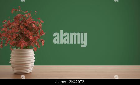 Table en bois ou étagère avec vase en poterie avec marguerites rouges, fleurs sauvages, ornement, prairie, herbe, encore la vie, branche dans vase, fond vert avec Banque D'Images