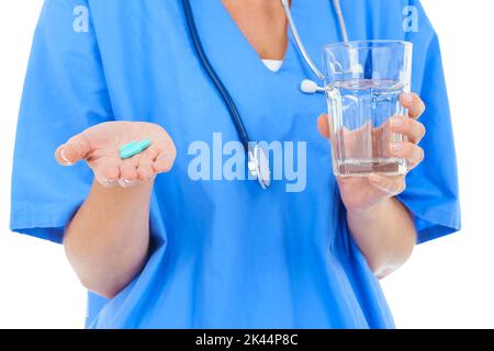 Take two of these daily with water. Cropped image of a doctor holding pills and a glass of water. Banque D'Images