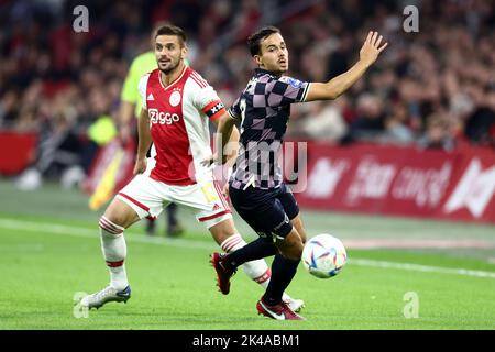 AMSTERDAM - (lr) Dusan Tadic d'Ajax, Mats Deijl ou Vas-y Eagles pendant le match néerlandais Eredivisie entre Ajax Amsterdam et Vas-y Eagles à la Johan Cruijff Arena sur 1 octobre 2022 à Amsterdam, pays-Bas. ANP VINCENT JANNINK Banque D'Images