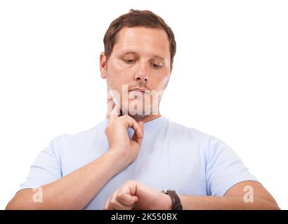C'est un peu rapide aujourd'hui... jeune homme prenant son rythme cardiaque sur fond blanc. Banque D'Images