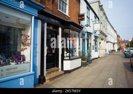 Boutiques à la façade géorgienne dans la High Street de Market Harborough Banque D'Images