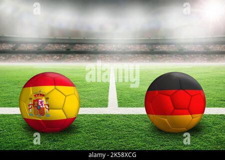 L'Espagne contre l'Allemagne football dans un stade en plein air lumineux avec des drapeaux espagnols et allemands peints. Concentrez-vous sur le premier plan et le ballon de football avec un rayon peu profond Banque D'Images