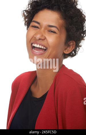Rire est bon pour vous. Une magnifique jeune femme riant à l'appareil photo. Banque D'Images