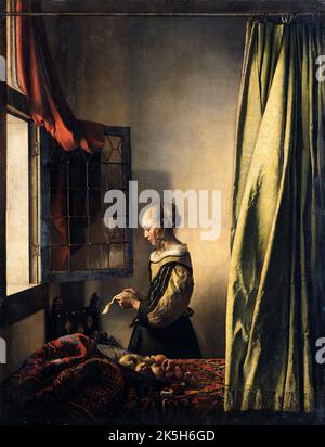 Fille lisant une lettre à une fenêtre ouverte. Johannes Vermeer. 1657–1659. Huile sur toile. Banque D'Images
