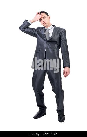 Homme fatigué en studio léger. Arrière-plan blanc. Banque D'Images