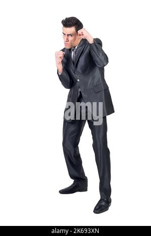 Homme d'affaires en cause en position de combat Banque D'Images