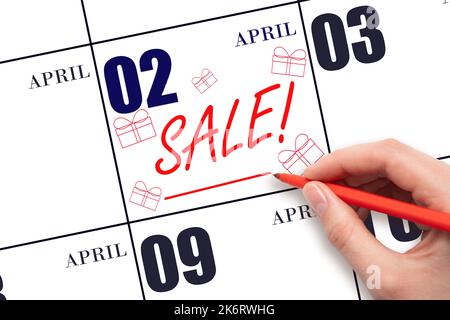 2nd jour d'avril. Vente de texte à la main et création de boîtes-cadeaux à la date du calendrier 2 avril. Rappel d'achat. Achats en ligne. Mois de printemps, jour du TH Banque D'Images