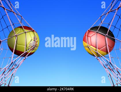 Deux ballons de football en drapeaux Espagne et Allemagne , dans un filet Banque D'Images