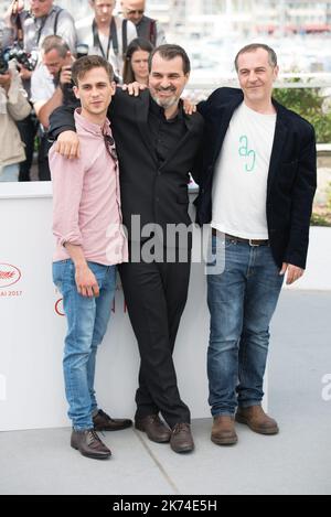 L'acteur Zsombor Jager, le réalisateur Kornel Mundruczo et l'acteur Merab Ninidze participent à la photocall 'Jupiter's Moon' lors du Festival annuel du film de Cannes 70th Banque D'Images