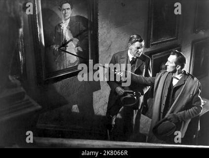 Andre Morell & Peter Cushing film: The Hound of the Baskervilles; Sherlock Holmes: The Hound of the Baskervilles (UK 1959) personnages: Docteur John Watson, Sherlock Holmes / Sherlock Holmes Verfilmung Directeur: Terence Fisher 04 mai 1959 **AVERTISSEMENT** cette photographie est à usage éditorial exclusif et est le droit d'auteur du FILM DE MARTEAU et/ou du photographe attribué par la Société de film ou de production et ne peut être reproduite que par des publications en conjonction avec la promotion du film ci-dessus. Un crédit obligatoire pour LE FILM DE MARTEAU est requis. Le photographe doit également être crédité lorsqu'il est connu. Pas de comm Banque D'Images