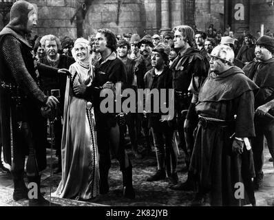 Olivia de Havilland, Errol Flynn, Eugene Pallette & Patric Knowles film: The Adventures of Robin Hood (USA 1938) personnages: Maid Marian,Robin Hood,Friar Tuck & Will Scarlett Directeur: Michael Curtiz, W Keighley 14 mai 1938 **AVERTISSEMENT** cette photographie est à usage éditorial exclusif et est le copyright de WARNER BROS. Et/ou le photographe assigné par la Société du film ou de la production et ne peut être reproduite que par des publications dans le cadre de la promotion du film ci-dessus. Un crédit obligatoire pour WARNER BROS est requis. Le photographe doit également être crédité lorsqu'il est connu. Aucune utilisation commerciale Banque D'Images