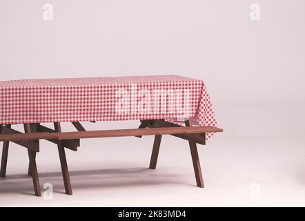 Table en bois et serviette rouge pour les fêtes en plein air et fond blanc. Banque D'Images