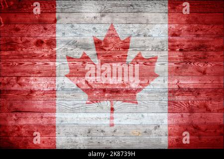 Une vignetted background image du drapeau du Canada peints sur des planches de bois d'un mur ou le plancher. Banque D'Images