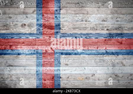 Une vignetted background image du drapeau d'Îles Féroé peints sur des planches de bois d'un mur ou le plancher. Banque D'Images