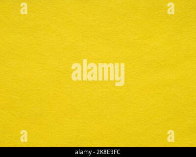 Fond de feutre jaune vif. Tissu en coton jaune : gros plan sur la texture du tissu. Fond d'écran plein cadre pour les œuvres d'art et de papeterie. Velours Banque D'Images