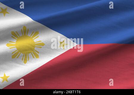 Drapeau des Philippines avec de grands plis et un gros plan sous l'éclairage du studio à l'intérieur. Les symboles officiels et les couleurs de la bannière en tissu Banque D'Images