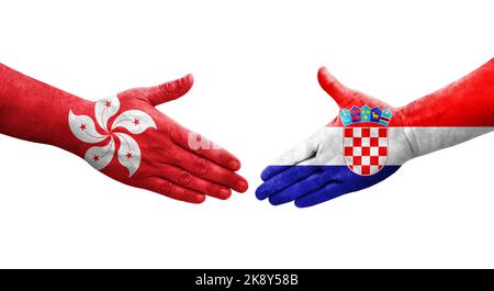 Poignée de main entre la Croatie et Hong Kong drapeaux peints sur les mains, image transparente isolée. Banque D'Images