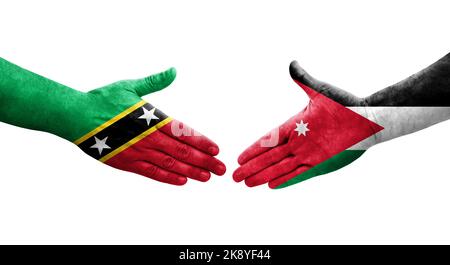 Poignée de main entre la Jordanie et Saint-Kitts-et-Nevis drapeaux peints sur les mains, image transparente isolée. Banque D'Images