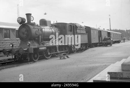 Les chemins de fer de l'État, SJ L26 1765 avec des trains de voyageurs. Banque D'Images