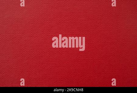 Carton rouge vierge avec motif de cellule comme fond, surface rouge vif pour la décoration de vacances Banque D'Images