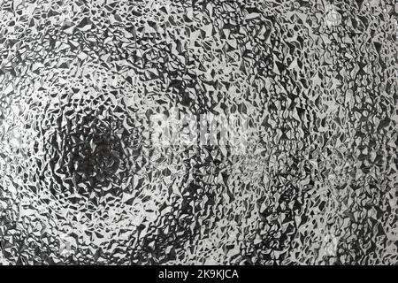 Verre transparent ondulé avec motif géométrique, cercles concentriques flous, gros plan Banque D'Images