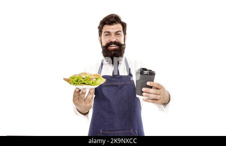 Délicieux croissant. Profitez de votre repas. Un gars qui sert des croissants, de la laitue farcie et des légumes frais. Une alimentation saine. Repas combiné. Concept Cafe Food. Homme Banque D'Images