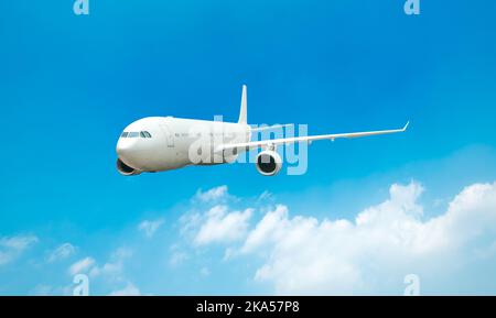 Grand avion de passagers volant dans le ciel bleu Banque D'Images