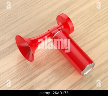 Corne d'air portable rouge sur table en bois Banque D'Images