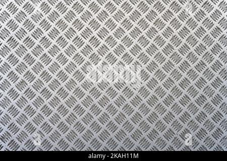 Un fond métallique avec une bande de roulement Banque D'Images