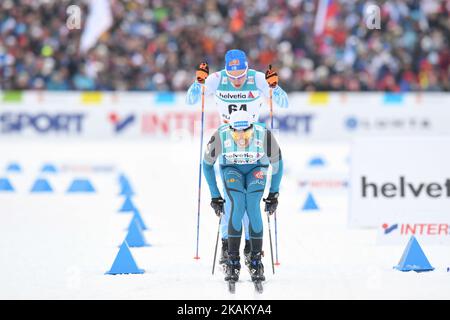 Iivo Niskanen de Finlande, juste derrière Achbadrakh Batmunkh de Mongolie, lors de la finale de la Classique individuelle de cross-country 15km de Men, au Championnat du monde nordique de ski FIS 2017 à Lahti. Mercredi, 29 février 2017, à Lahti, en Finlande. Photo par Artur Widak *** Veuillez utiliser le crédit du champ de crédit *** Banque D'Images