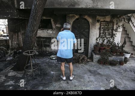 Photos de la région plus large de Mati et Neos Voutsas dans l'est de l'Attique près d'Athènes le 25 juillet 2018 après l'incendie. 12760 acres de terrain et 380 véhicules ont été brûlés à Mati. Le feu qui a eu lieu le 23 juillet 2018 a été l'un des plus fidèles du siècle. Le nombre de morts a été élevé à plus de 80 victimes. Beaucoup de gens manquent encore et la recherche est toujours en cours. La région est toujours sans électricité. Le premier compte a été que 2500 maisons ont été détruites. Mati, Attica, Grèce (photo de Nicolas Economou/NurPhoto) Banque D'Images