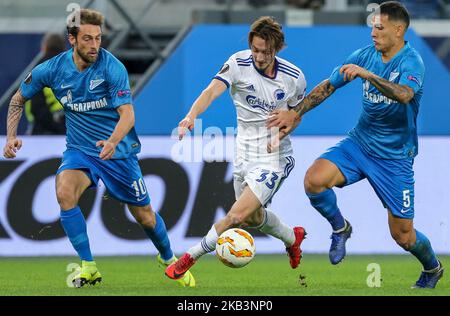 Claudio Marchisio (L), Leandro Paredes du FC Zenit Saint-Pétersbourg et Rasmus Falk (C) du FC Copenhague vie pour le match du groupe C de l'UEFA Europa League entre le FC Zenit Saint-Pétersbourg et le FC Copenhague au stade de Saint-Pétersbourg à 29 novembre 2018 à Saint-Pétersbourg, en Russie. (Photo par Igor Russak/NurPhoto) Banque D'Images