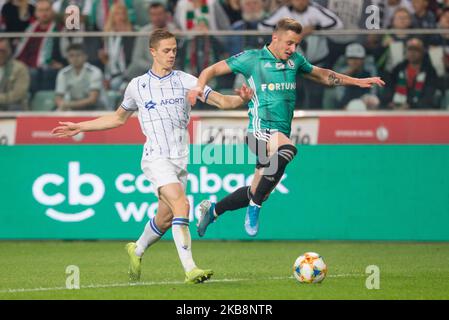 Robert Gumny (Lech), Arvydas Novikovas (Legia) pendant le match PKO Ekstraklasa entre Legia Varsovie et Lech Poznan, à Varsovie, Pologne, sur 19 octobre 2019. (Photo par Foto Olimpik/NurPhoto) Banque D'Images