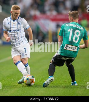 Kamil Jozwiak (Lech), Arvydas Novikovas (Legia) pendant le match du PKO Ekstraklasa entre Legia Varsovie et Lech Poznan, à Varsovie, en Pologne, sur 19 octobre 2019. (Photo par Foto Olimpik/NurPhoto) Banque D'Images