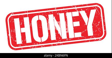 TEXTE AU MIEL inscrit sur l'enseigne rouge en forme de grungy. Banque D'Images
