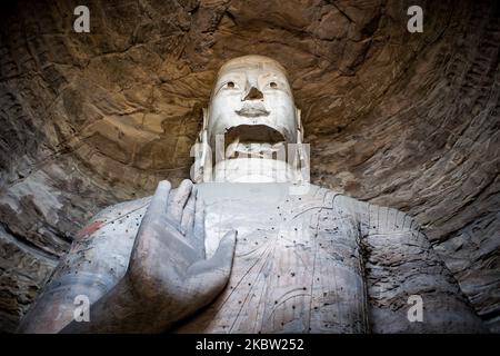 Yungang, Chine, 25 mai 2011. Un bouddha des grottes du Yungang. Ce site est une ancienne grotte de temple bouddhiste chinoise près de la ville de Datong dans la province de Shanxi. Ce sont d'excellents exemples d'architecture de coupe de roche et l'un des trois plus célèbres sites de sculpture bouddhiste antiques de la Chine. (Photo par Emeric Fohlen/NurPhoto) Banque D'Images