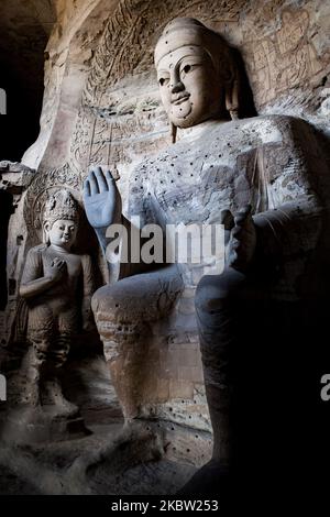 Yungang, Chine, 25 mai 2011. Un bouddha des grottes du Yungang. Ce site est une ancienne grotte de temple bouddhiste chinoise près de la ville de Datong dans la province de Shanxi. Ce sont d'excellents exemples d'architecture de coupe de roche et l'un des trois plus célèbres sites de sculpture bouddhiste antiques de la Chine. (Photo par Emeric Fohlen/NurPhoto) Banque D'Images