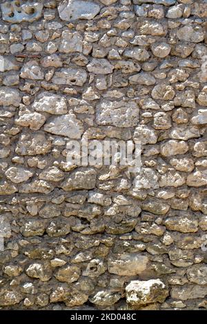 Un vieux mur en pierre à gravats plein cadre arrière gros plan Banque D'Images