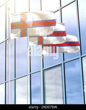 Mâts de drapeaux avec le drapeau des îles Féroé en face du centre d'affaires Banque D'Images