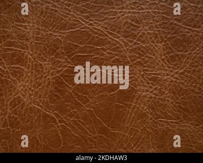 Peau de cuir brun orange foncé texture naturelle avec motif lignes abstrait. Utilisez un papier peint ou un décor luxueux Banque D'Images